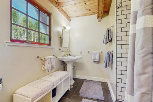a bathroom with a sink and a window at Serene Lakes Splendor in Soda Springs