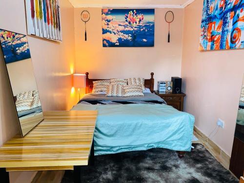 Ένα ή περισσότερα κρεβάτια σε δωμάτιο στο Ruaka