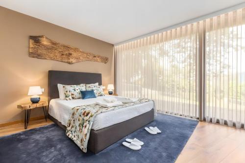 Postel nebo postele na pokoji v ubytování Casas De Bouro 3 Casa Do Alecrim