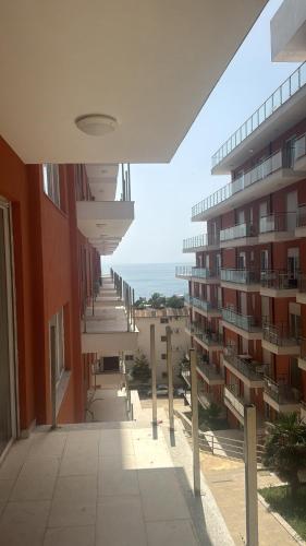 a view of a building with the ocean in the background at Sea view in Shëngjin