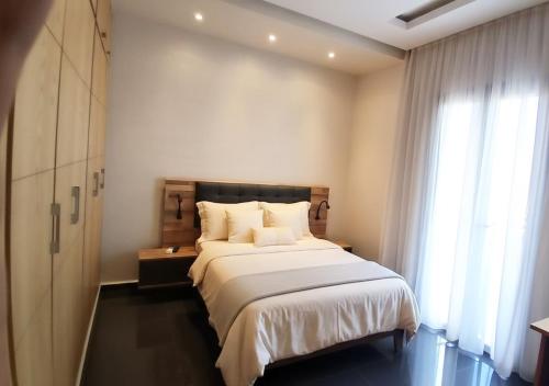 Postel nebo postele na pokoji v ubytování Villa Élégance Familiale