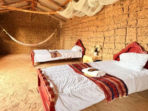 Postel nebo postele na pokoji v ubytování rancheria divi divi
