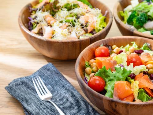three bowls of salad on a table with a fork at Mitsui Garden Hotel Nagoya Premier in Nagoya