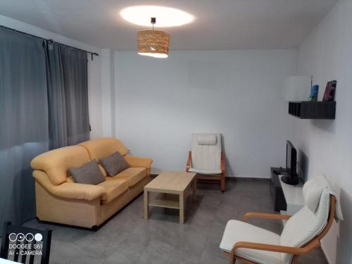 a living room with a couch and a table at Ca L'Esparter in Bocairent