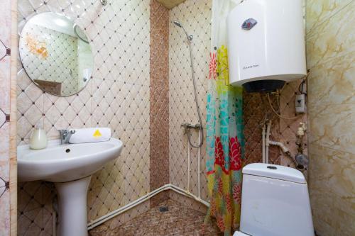 a small bathroom with a sink and a toilet at 1 bedroom Modern, Sunny apartment in Amiryan street AM104 in Yerevan
