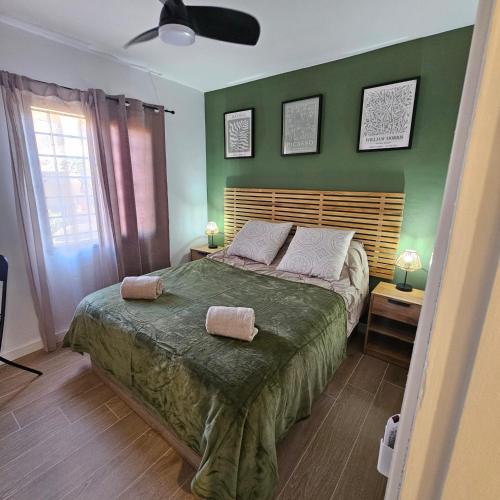 a bedroom with a bed with two towels on it at Duna Lagoon in Corralejo