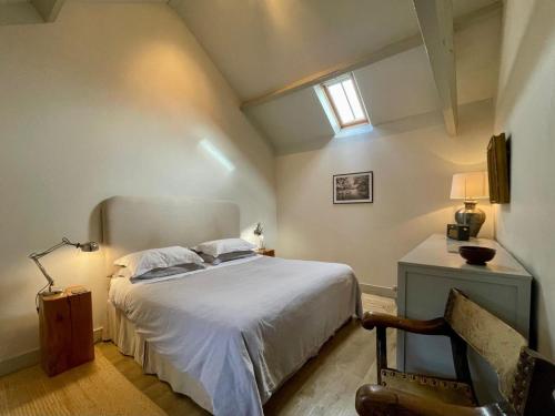 a bedroom with a white bed and a window at 1 Bed in Ullswater 94064 in Watermillock