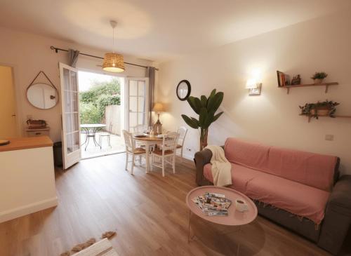 a living room with a couch and a table at Domaine de Fayence in Fayence