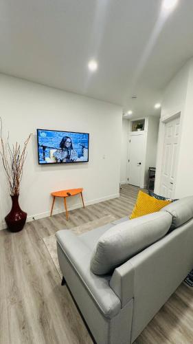 a living room with a couch and a table at Modern Basement Suite near West Edmonton Mall in Edmonton