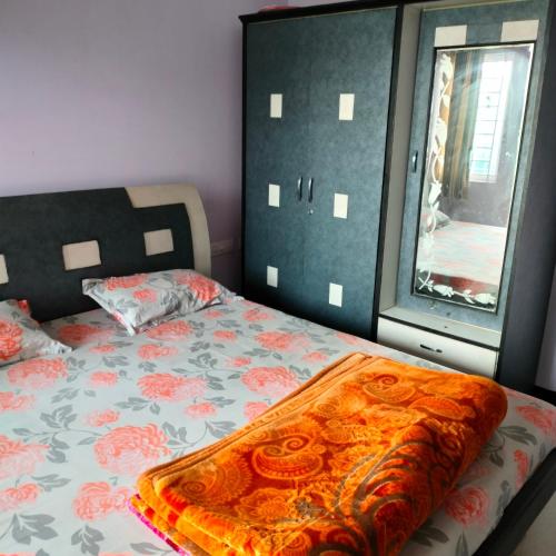 a bedroom with a bed and a window at Wild Nest Kotagiri in Kotagiri