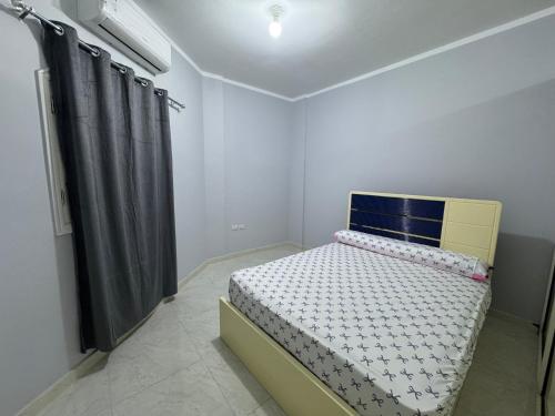 Ένα ή περισσότερα κρεβάτια σε δωμάτιο στο Peace Homes