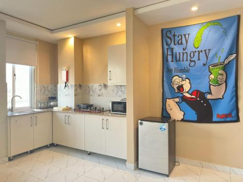 Küche/Küchenzeile in der Unterkunft Cozy 1BR Designer Apartment, Gulberg Greens