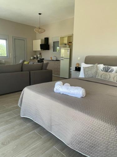 a bedroom with a bed with two towels on it at BEACH WHTE VILLAs one bedroom in Minia