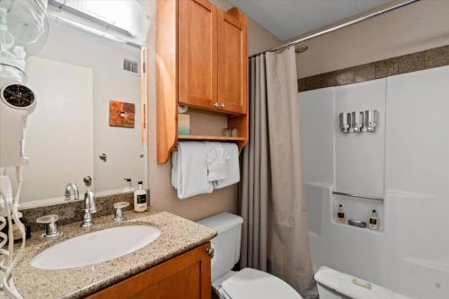 a bathroom with a sink and a toilet at Kaibab - Adobe Village condo - 2 bedroom in Oak Creek