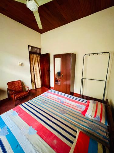 a bedroom with a large bed in a room at Peaceful Haven Cozy Retreat in Nugegoda