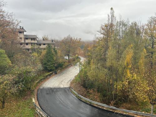an empty road with trees on the side of it at La Piccola Stella in Castel del Giudice