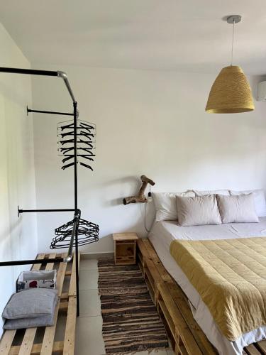 a bedroom with a bed and a lamp and a rug at Midcentury modern 1 bedroom apartment in Tirana in Tirana