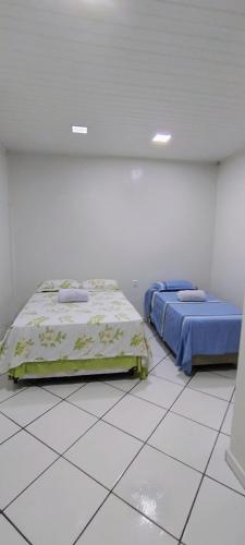 Postel nebo postele na pokoji v ubytování Casa, ótima localização, fantástica