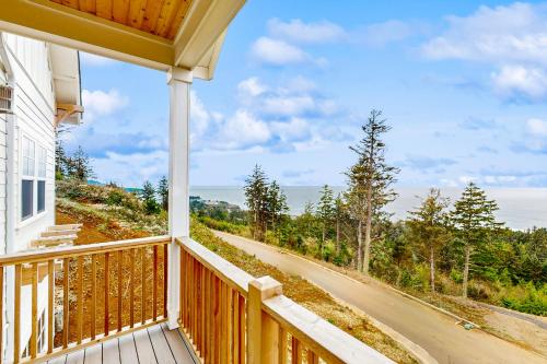 a balcony of a house with a view of a road at Pacific Perch in Depoe Bay