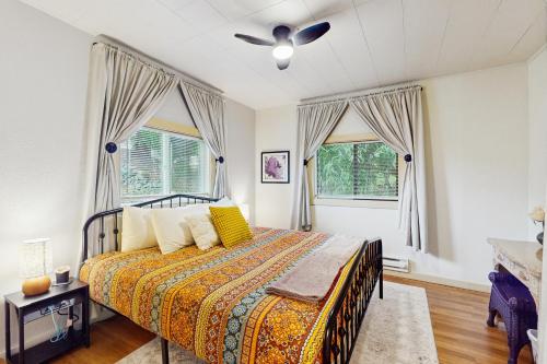 a bedroom with a bed and a ceiling fan at Summit Lookout Bungalow in South Bend