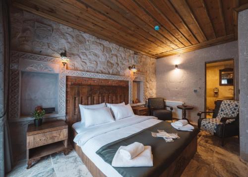 Postel nebo postele na pokoji v ubytování Cappadocia Alin Stone