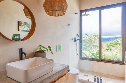 a bathroom with a sink and a mirror at Casa Oasis in San Luis