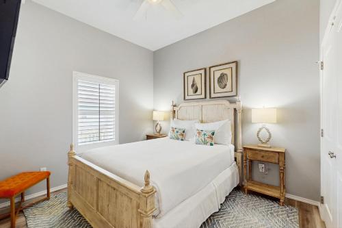 a bedroom with a large bed and a window at Gulf Breeze in Rockport