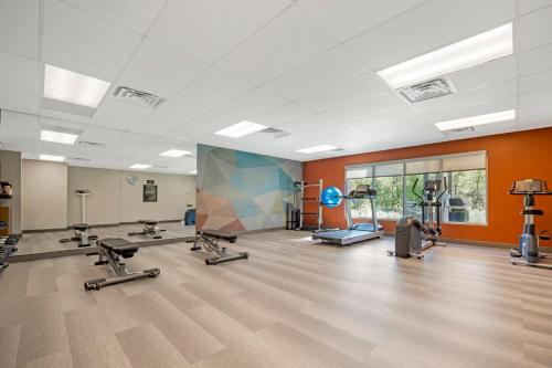 a gym with several treadmills and machines in a room at Candlewood Suites Lawrenceville - Princeton by IHG in Lawrenceville