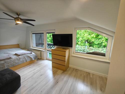 Postel nebo postele na pokoji v ubytování Dom na Kasztanowej