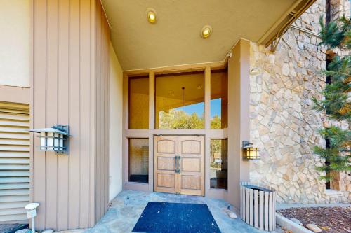 a front door of a house with a stone wall at Million Dollar View- 419 in Rockwood