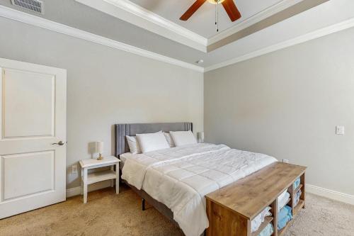a bedroom with a bed and a ceiling fan at Blue Pearl in Navarre