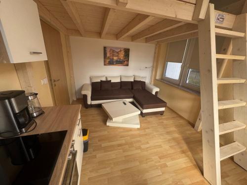 a small living room with a couch and a table at Apartment Wintergarten in Reichenbach im Vogtland