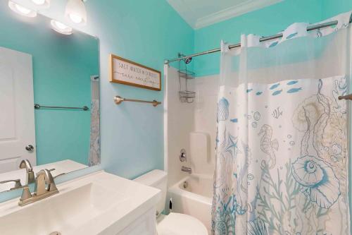 a bathroom with a sink and a shower curtain at 28 White Horse Dr, Ocean Pines, MD 21811 in Ocean Pines