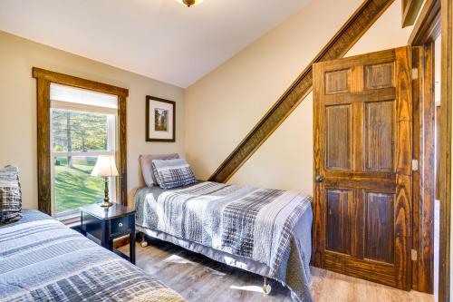 a bedroom with two beds and a window at half Mi to Song Mountain Resort Ski Getaway! in Tully