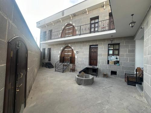 a large building with a balcony and a courtyard at Star Palace in Diyarbakır