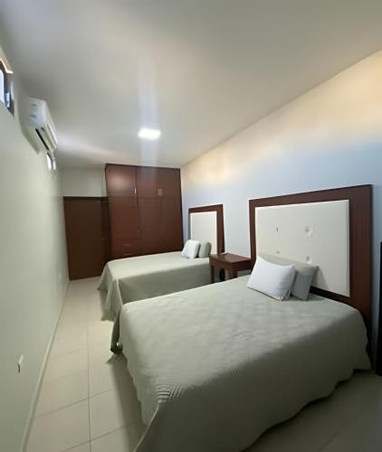 a hotel room with two beds at Casa Madre Perla - a 2 min de la Playa Miramar in Colonia Miramar