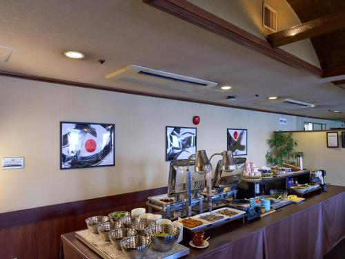 a bakery with a counter with pastries on it at APA Hotel Kurashiki Ekimae in Kurashiki