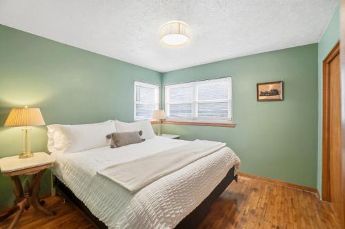 a bedroom with a large bed and a window at The Stoop On Spencer Drive in Van Wert