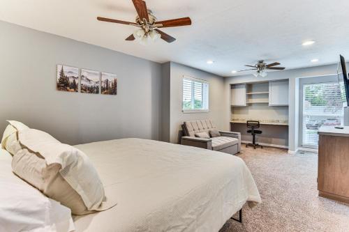 a bedroom with a bed and a ceiling fan at Mountain-View Retreat with Hot Tub in Centerville! in Centerville