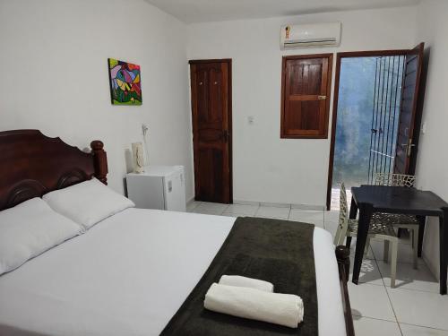 Postel nebo postele na pokoji v ubytování Quarto Feliz