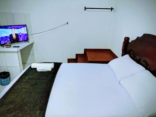 TV a/nebo společenská místnost v ubytování Quarto Feliz