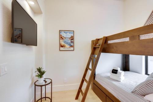 a bedroom with a bunk bed and a mirror at 4 Mi to Dtwn Luxe Gem with Pool in Lake Havasu City in Lake Havasu City