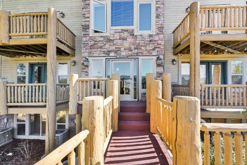 a wooden stairway leading to a house with a porch at Eden Mountain Condo with Views Pool & Hot Tub Access in Wolf Creek Village
