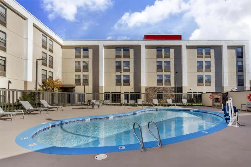 an image of a swimming pool in front of a building at Best Western Plus Bellingham in Bellingham