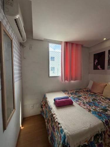 Una cama o camas en una habitación de Recanto do Sol, 2 quartos, piscina ambiente tranquilo