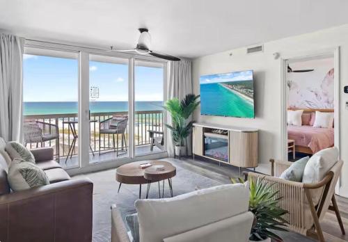 a living room with a view of the ocean at Sea La Vie - Pelican Beach Resort in Destin