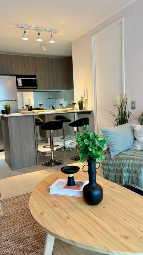 a living room with a couch and a table at Duna & Mar I Concon in Concón
