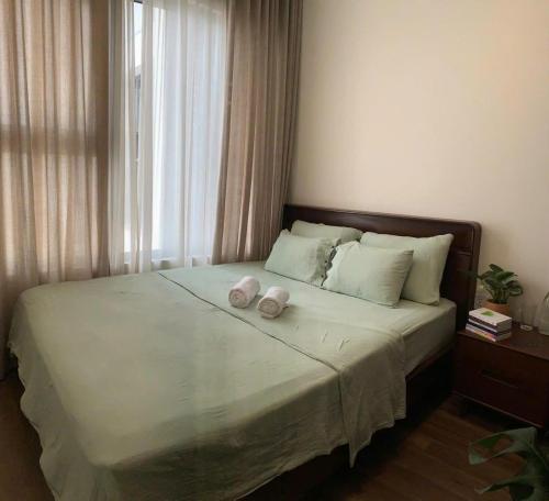 Ένα ή περισσότερα κρεβάτια σε δωμάτιο στο The inner Home Shared Apartment Hanoi