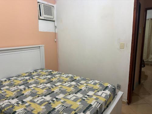 Ένα ή περισσότερα κρεβάτια σε δωμάτιο στο Casa simples e aconchegante em Unamar - Cabo Frio