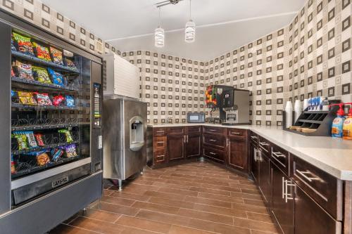 a large kitchen with a washer and dryer at Red Roof Inn Houston Brookhollow in Houston